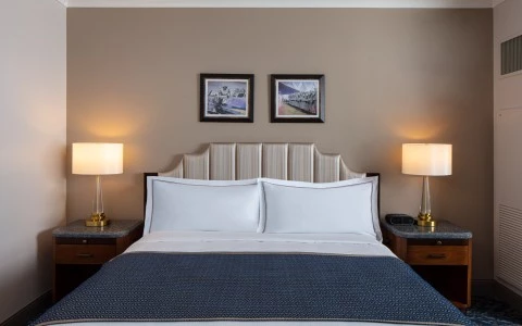 front view of a double bed with two side lamps11