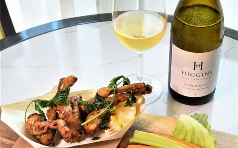frog legs with a side of celery and carrots paired with white wine12