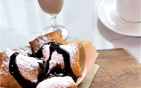 sweet beignets topped with chocolate syrup9