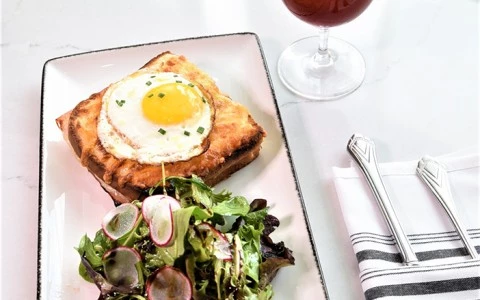 sandwich with egg on top and side salad3