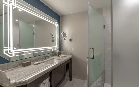 a bathroom with a mirror and a sink