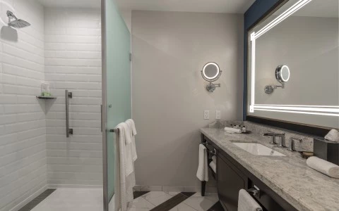 a bathroom with a mirror and a sink