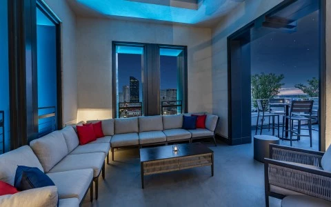 a room with a couch and tables