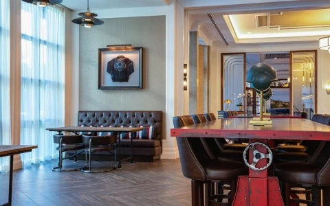 kilroys part view with a big red table and a sofa 2
