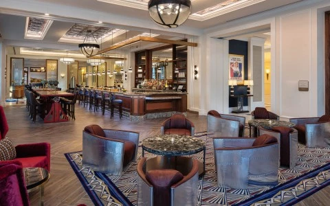 kilroys room with rounded tables and big chairs 0