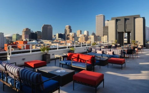 terrace with sofas and an amazing city view 0