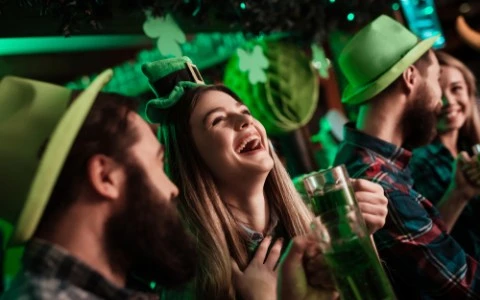 friends smiling and celebrating st patricks day