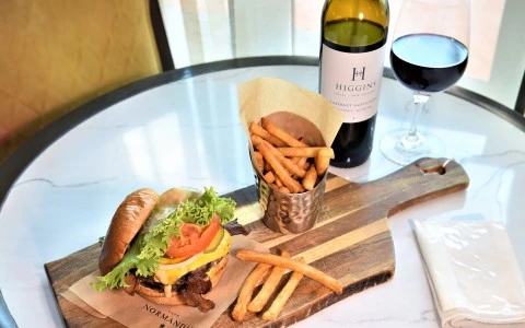 a burger and fries on a cutting board38