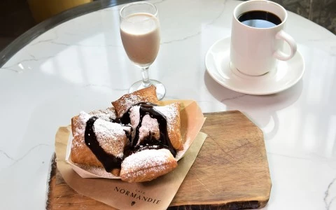 a plate of pastries and a glass of coffee45