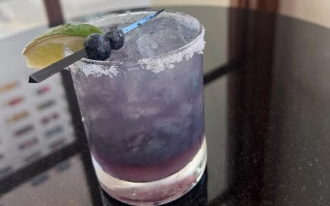 a glass with a drink and a knife13