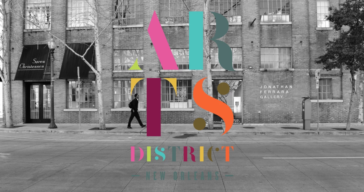 arts district new orleans text over black and white street image