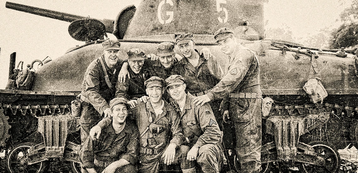 a group of men posing for a photo