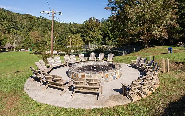 a group of chairs around a fire pit