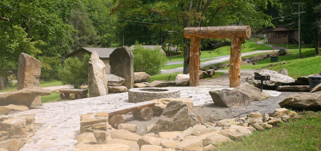 a large rock structure with a fire pit