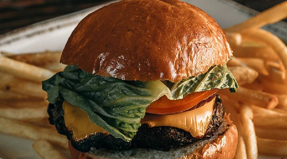 a hamburger with lettuce and tomato