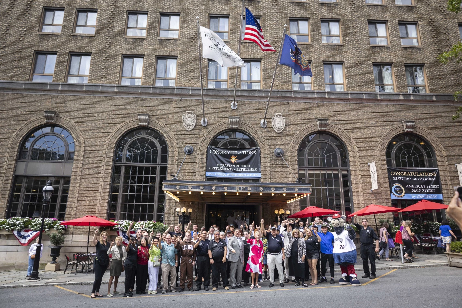 a group of people standing in front of a building