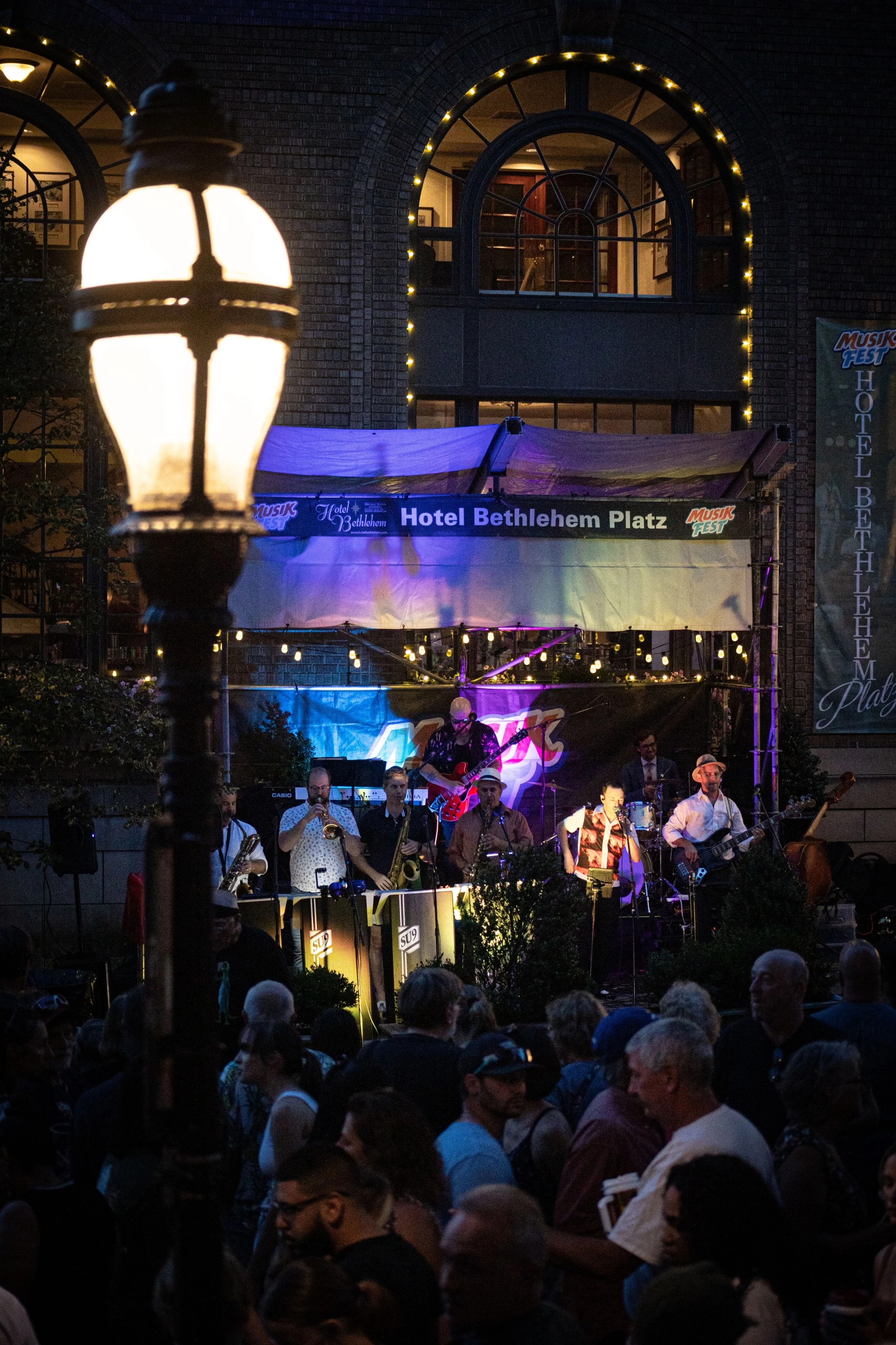 a group of people playing instruments on a stage
