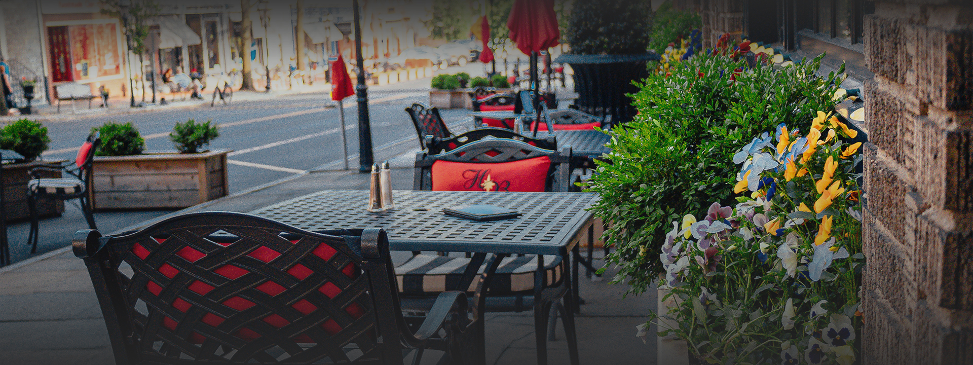 a table and chairs on a sidewalk