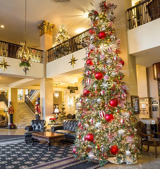 a large christmas tree in a lobby
