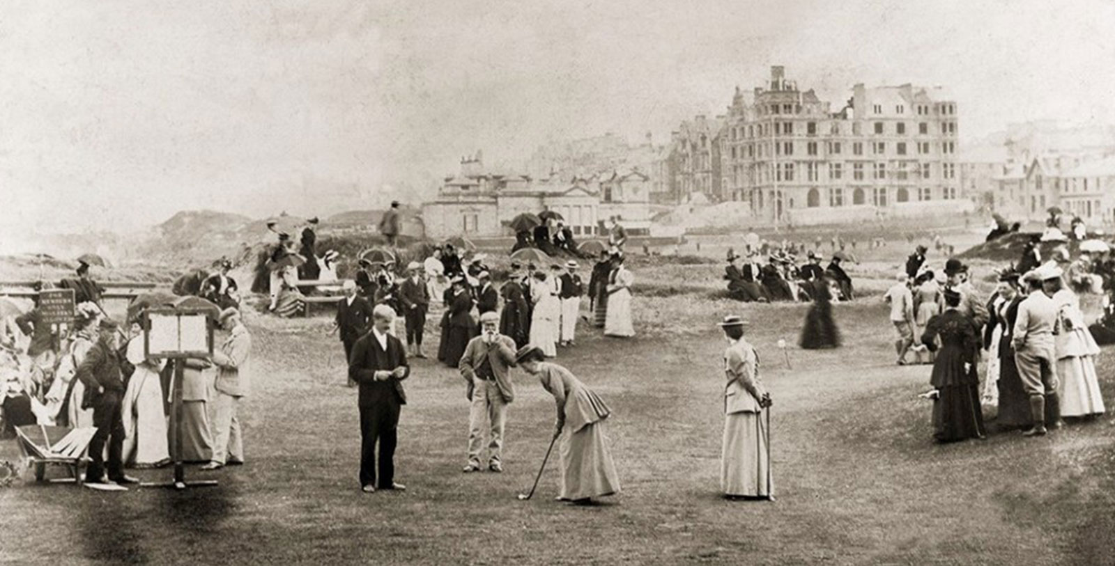 a group of people playing golf