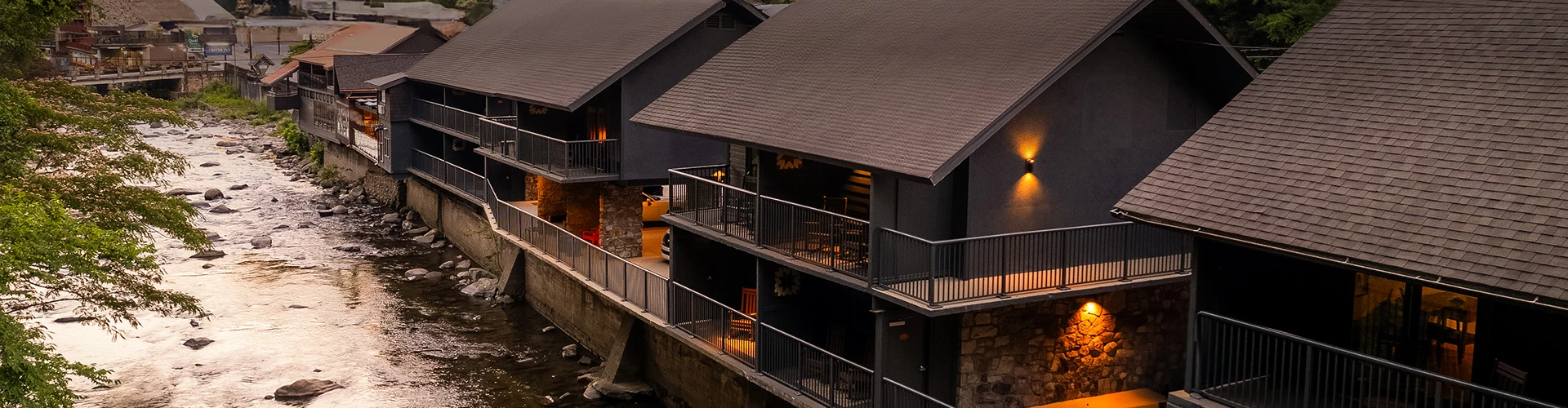 a two buildings with a bridge and a car