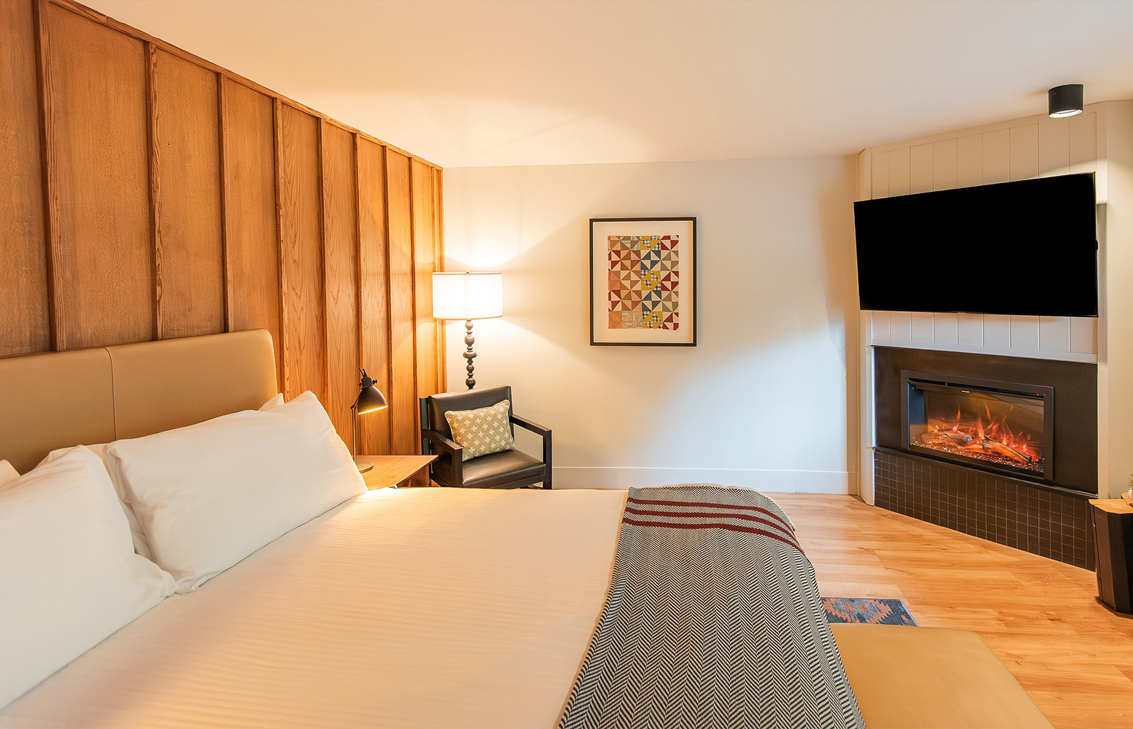 a room with a bed and a fireplace