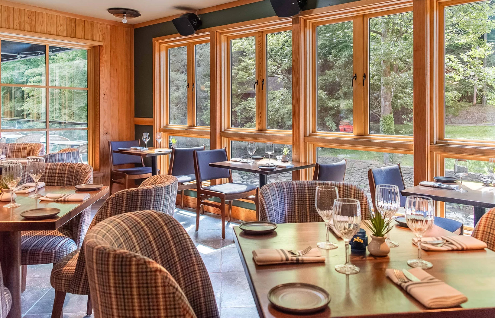 a room with a table and chairs and a window