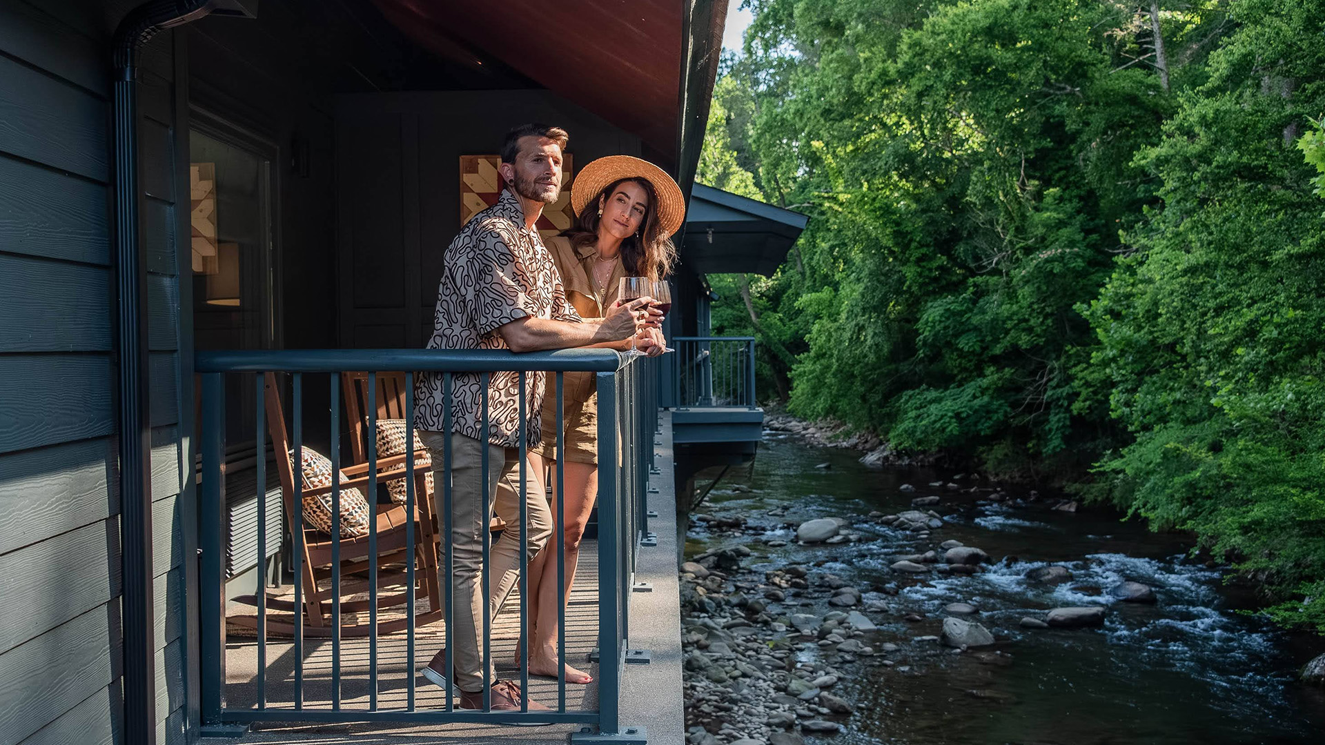 a man and woman standing on a porch