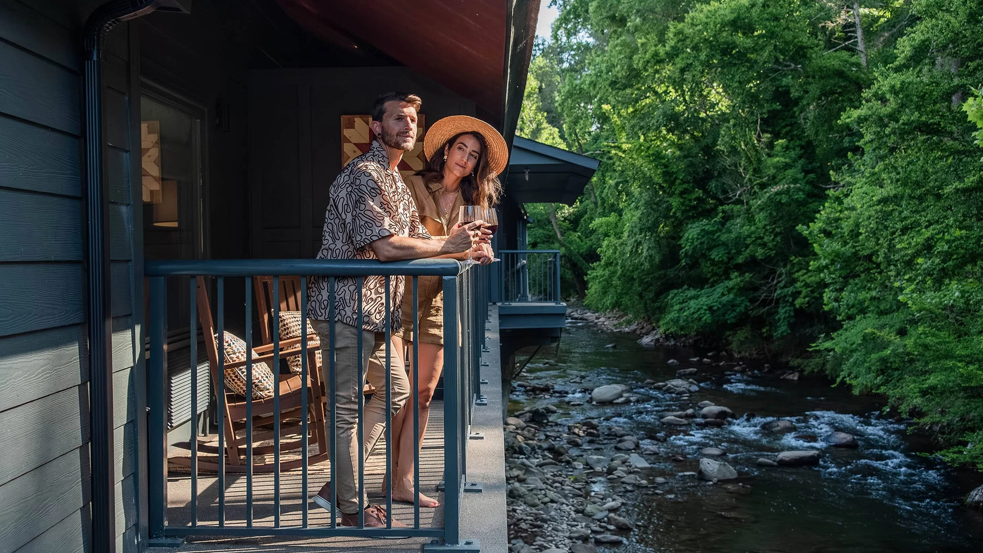 a man and woman standing on a porch