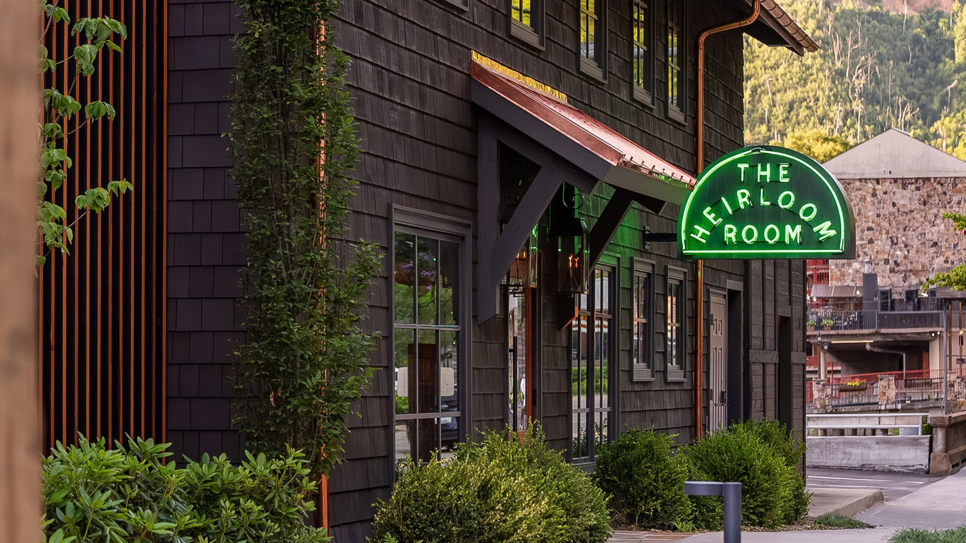 a building with a green sign