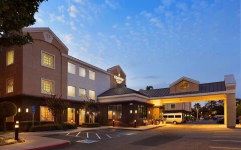 hotel entrance with overhead parking during sunset