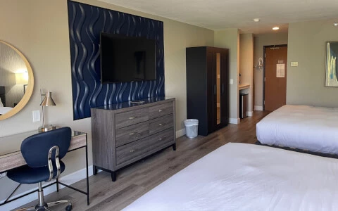hotel room with double beds and flat screen television