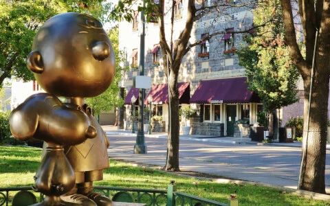park statue of cartoon characters in front of hotel entrance