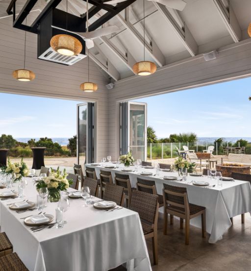 a dining room with tables and chairs