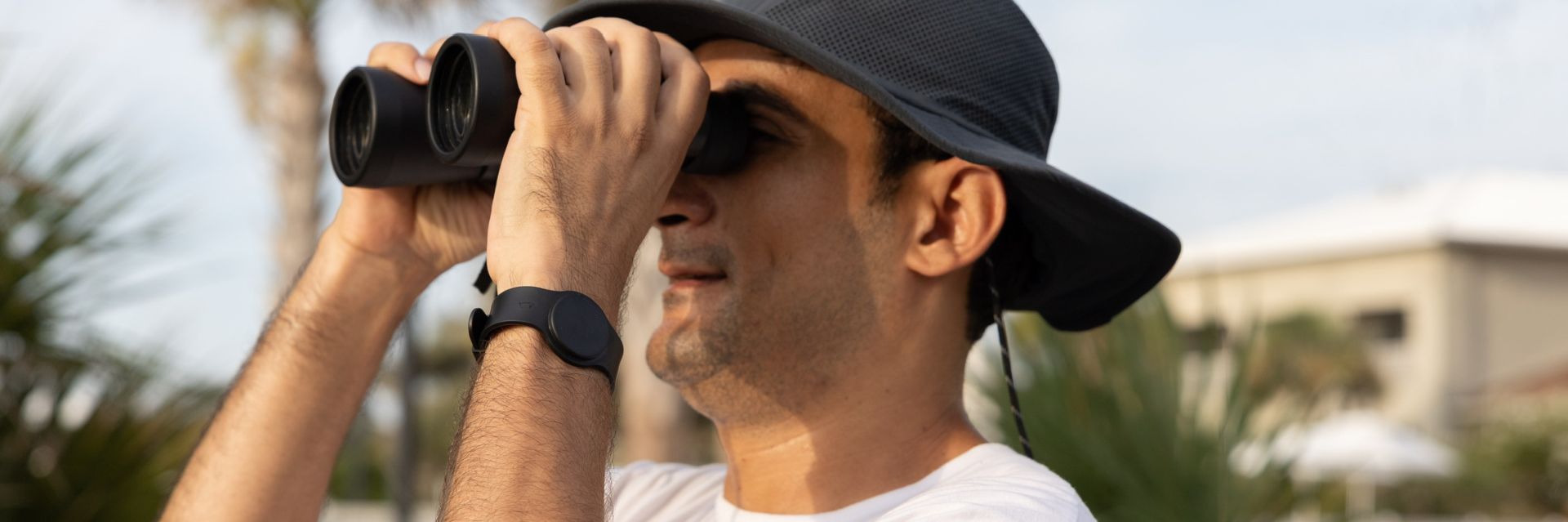 a man looking through a telescope