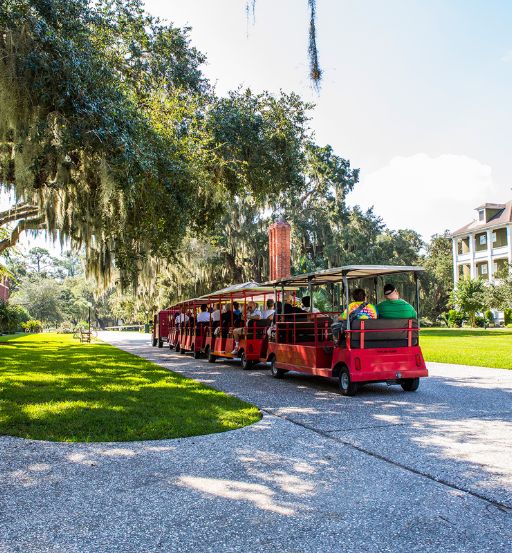 a red trolley with people on it