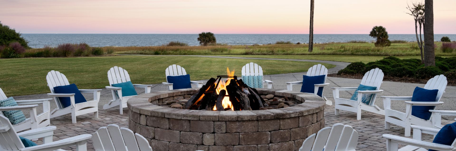 a fire pit with chairs around it