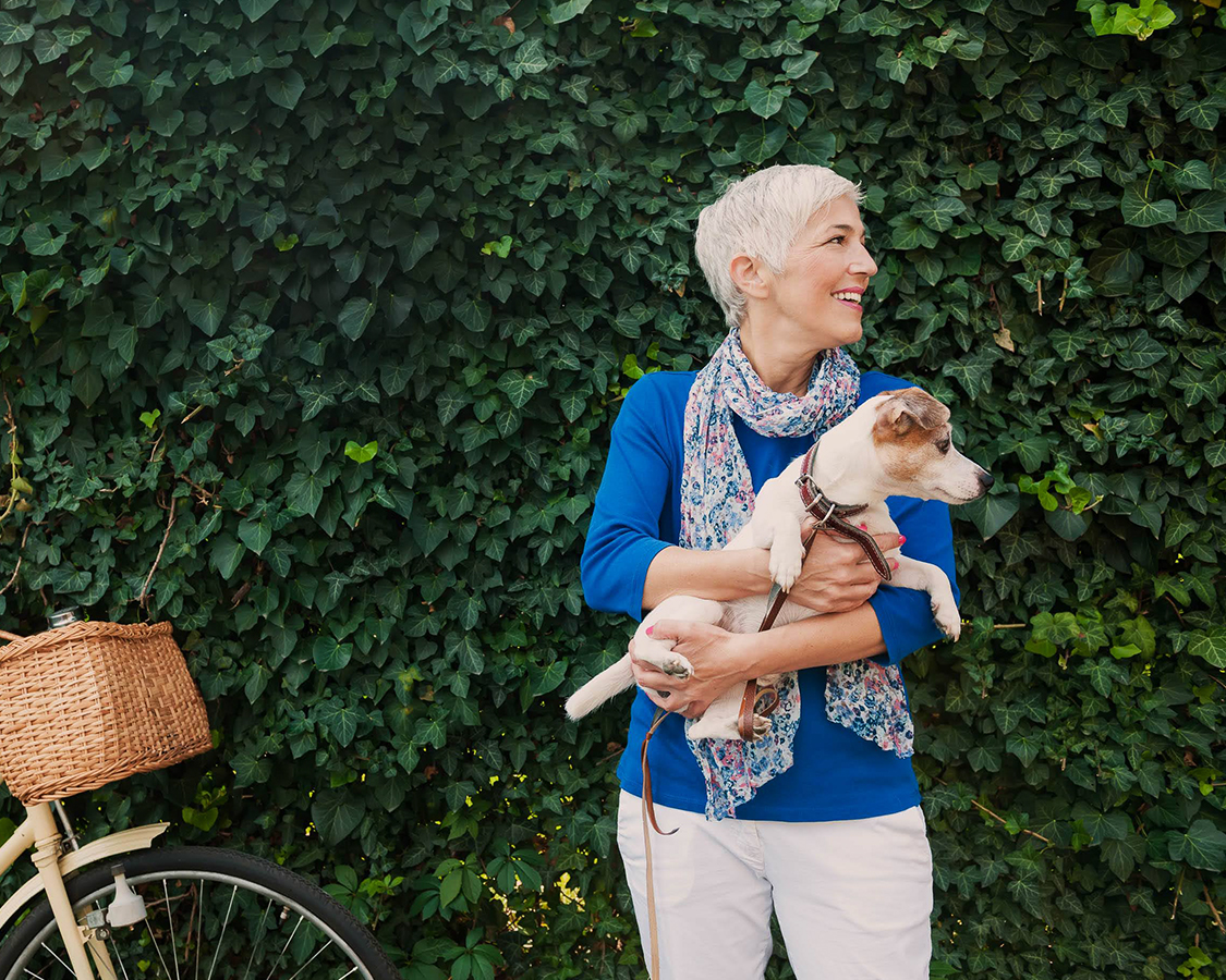 Woman holding her dog