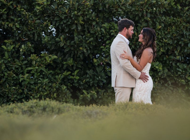 a man and woman in a white dress
