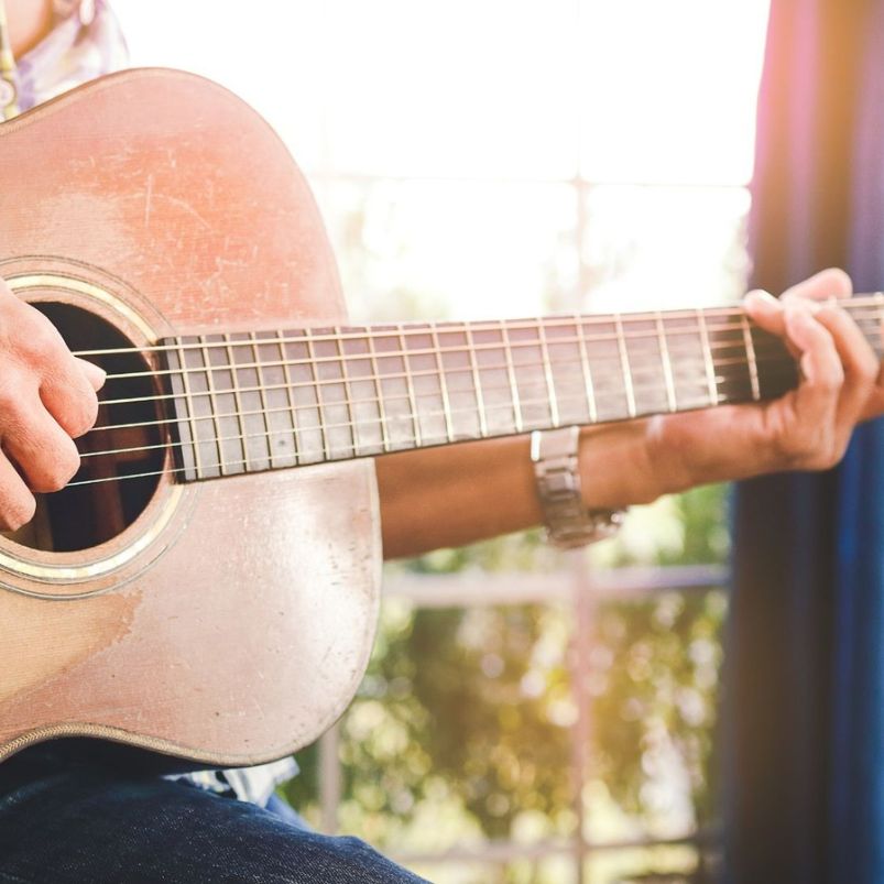 a person playing a guitar