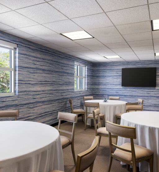 a room with tables and chairs