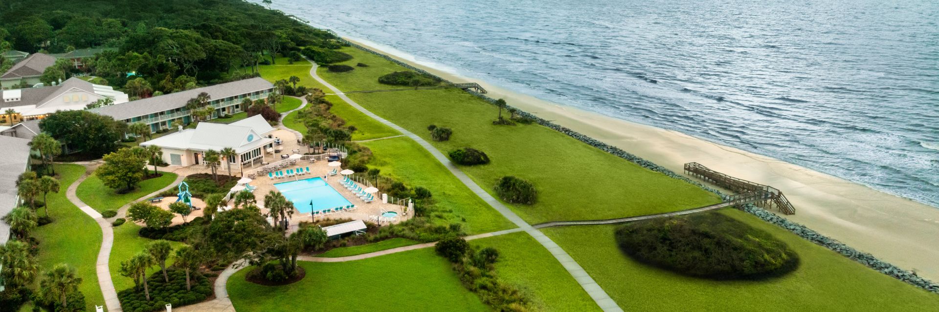 a swimming pool next to a beach
