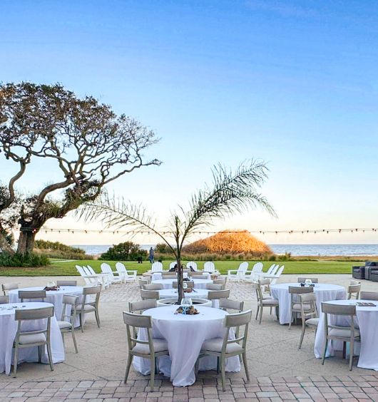 a group of tables and chairs outside