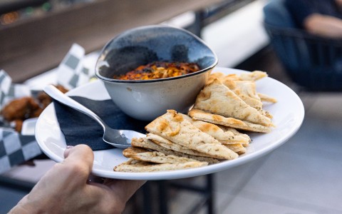 a plate of food and a spoon