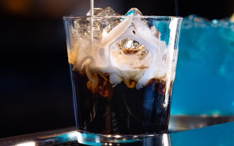 a glass with ice and liquid