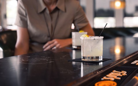 a two glasses of drink on a counter