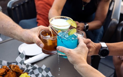 a group of people holding drinks