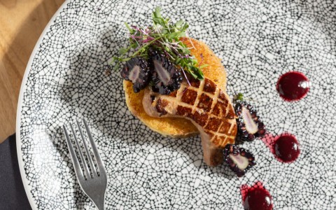 food on a plate with a fork and knife