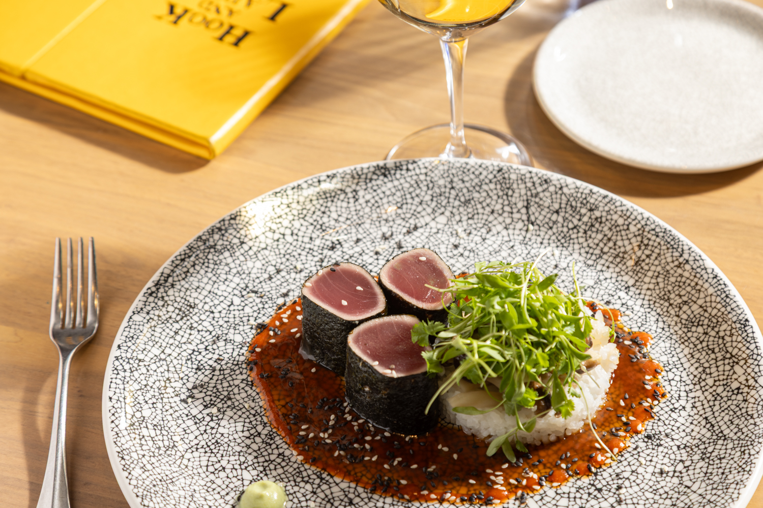 a plate of food and a glass of wine