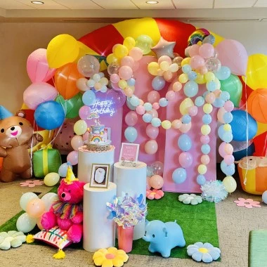 a room with balloons and decorations
